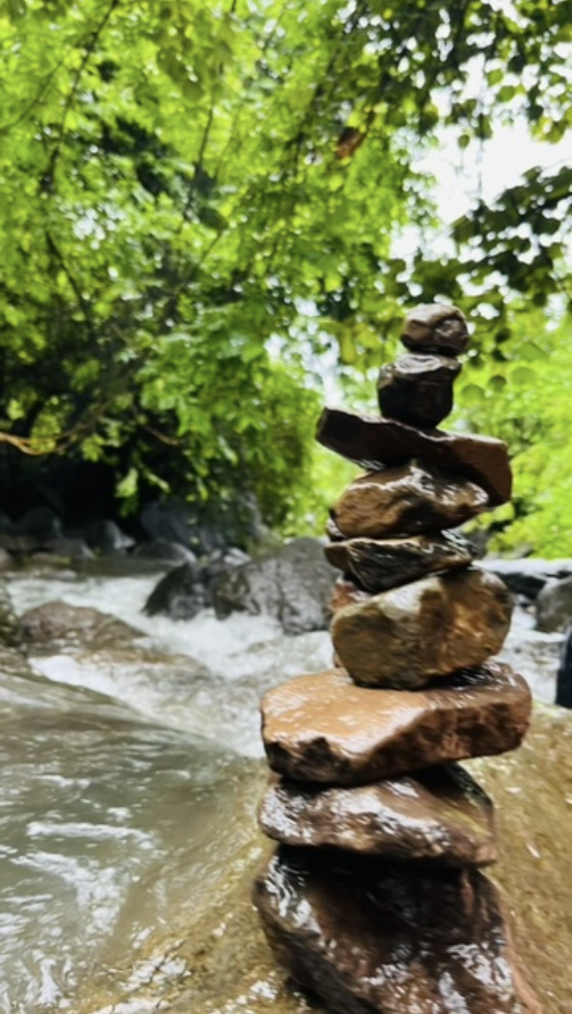 Stacked stones beside a river